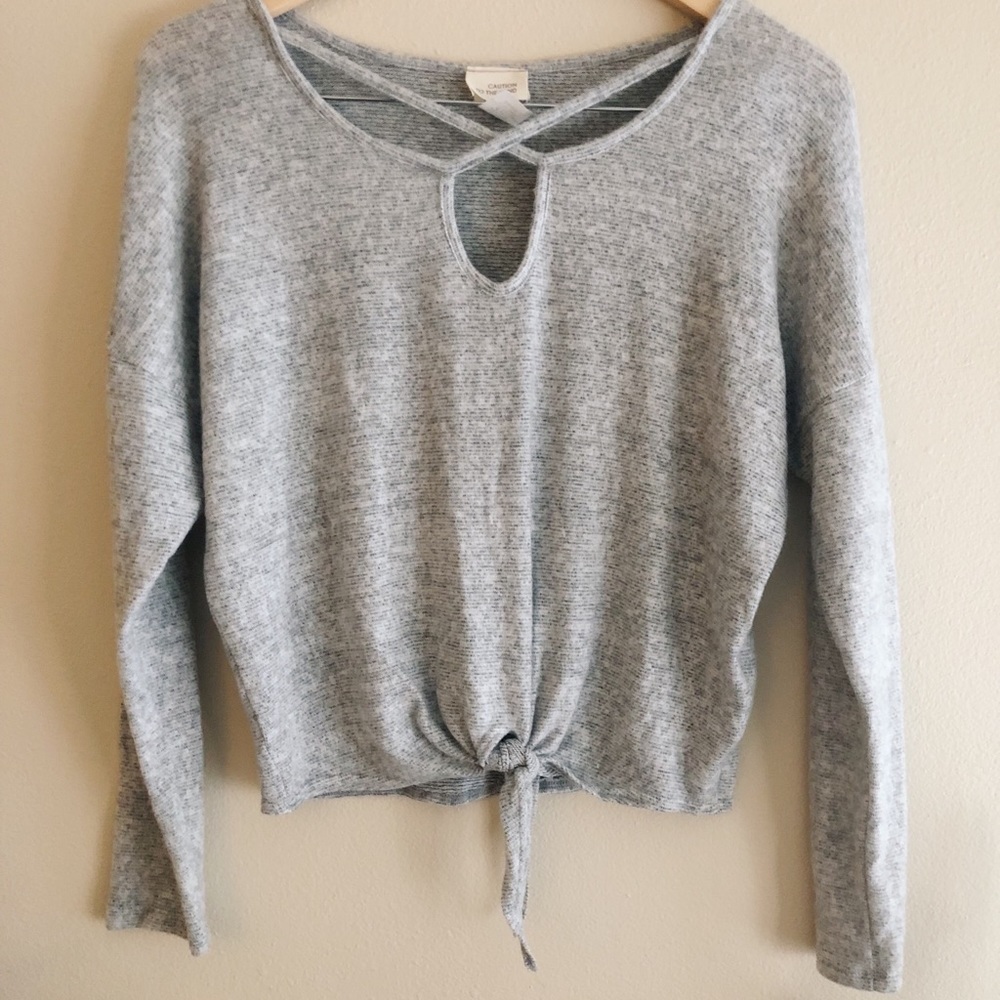 Grey tied sweater with cutout detail